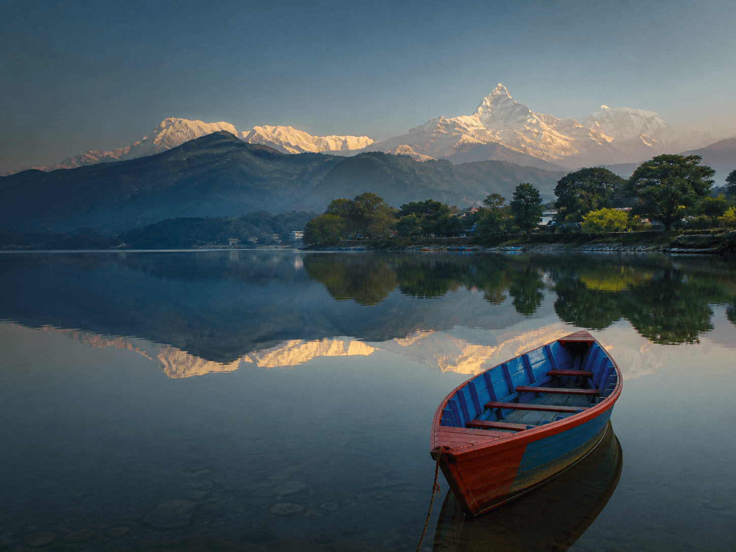 A quiet morning on Phewa Lake beneath the Annapurna mountains